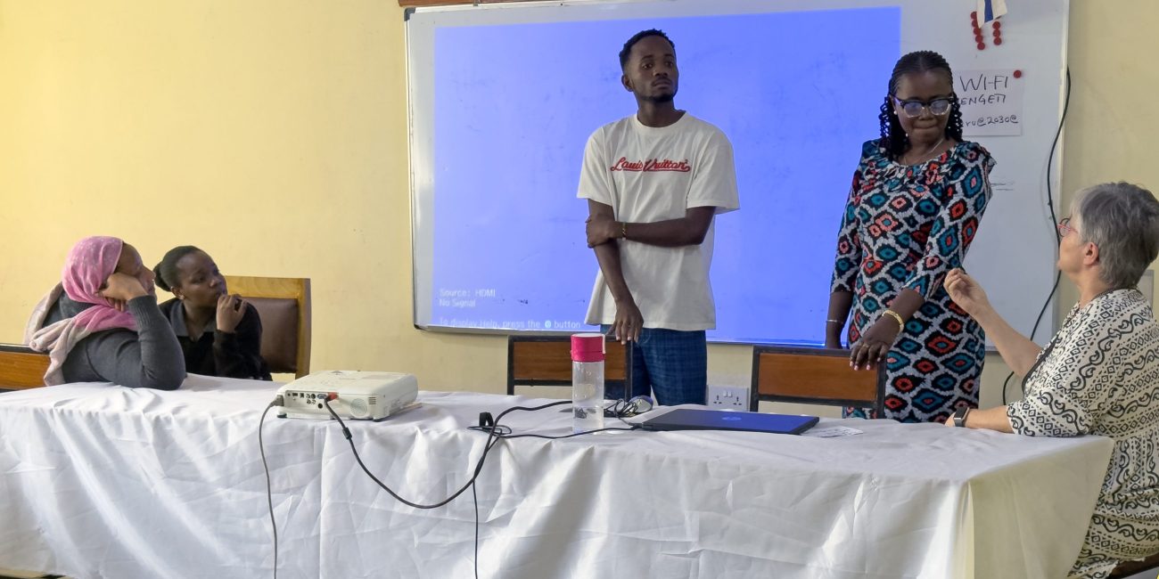 Jonathan Hoza sharing his learning journey. His interpreter was his former
teacher, Happiness W. Masaka, who also participates in the mentorship training.